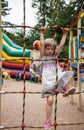 Active little girl climbing on a ladder Royalty Free Stock Photo