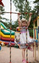 Active little girl climbing on a ladder Royalty Free Stock Photo