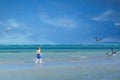 Active little kid boy having fun on Miami beach, Key Biscayne. Happy cute child running near ocean on warm sunny day Royalty Free Stock Photo