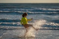 Active little kid running along sea beach during leisure sport activity. Sporty kid running in nature. Child run at Royalty Free Stock Photo