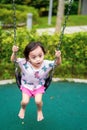 Active little toddler child playing swing at the playground. Happy and fun time Royalty Free Stock Photo