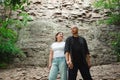 Active loving senior couple walking in beautiful summer forest - active retirement concept. Royalty Free Stock Photo