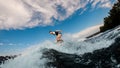 active man with an amputated hand ride the wave on wakeboard