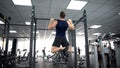 Active man doing pull ups in gym, body workout program, strong muscles training Royalty Free Stock Photo