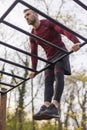 Active man doing pullups while exercising outdoors Royalty Free Stock Photo