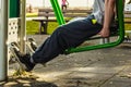 Active man exercising on leg press outdoor. Royalty Free Stock Photo