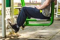 Active man exercising on leg press outdoor. Royalty Free Stock Photo