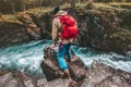 Active man hiker traveling with backpack alone