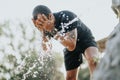 Active man in park refreshing and taking a break from workout. Royalty Free Stock Photo