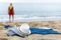 Active man resting. Clothes on the sand near sea Royalty Free Stock Photo