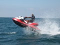Active man riding a red jet ski in the Red Sea Royalty Free Stock Photo