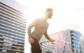 Active man running outside in the city Royalty Free Stock Photo