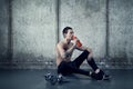 Active man with water bottle and dumbell Royalty Free Stock Photo