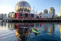 Active married couple paddling and kayaking in English Bay near science World in summer. Royalty Free Stock Photo