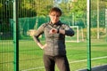 Active middle aged woman in sportswear looking at her wrist watch, exercise time Royalty Free Stock Photo