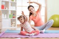 Active mother and child daughter are engaged in fitness, yoga, exercise at home Royalty Free Stock Photo