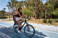 Active mother and child riding a bike together on outdoors background. Caucasian woman and baby boy on a bicycle Royalty Free Stock Photo