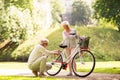 Happy senior couple with bicycle at summer park Royalty Free Stock Photo