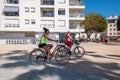 Active old age, people and lifestyle concept - happy senior couple riding bicycles in Estepona.