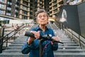 Active old woman riding electric scooter. Retired lady uses environmentally friendly city vehicle. Granny very old with Royalty Free Stock Photo