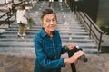 Active old woman riding electric scooter. Retired lady uses environmentally friendly city vehicle. Granny very old with Royalty Free Stock Photo