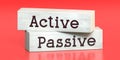 Active, passive - words on wooden blocks