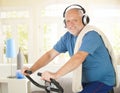 Active pensioner doing spinning with music Royalty Free Stock Photo