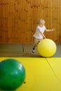 Active preschool boy playing with big ball in indoor sports hall/gym class Royalty Free Stock Photo