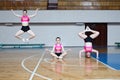 Active pretty girl in action jumping in the air, girl standing upside down, girl stand on hands, sport young woman sitting on the Royalty Free Stock Photo