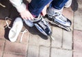 Active rest for children in the summer. Roller skating in the park Royalty Free Stock Photo