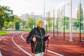 Active rest of the elderly theme. Sports and health in retirement. Caucasian very old woman with deep wrinkles doing Nordic