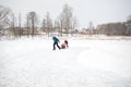 Active rest on nature. family skates on natural ice rink - lake in village.