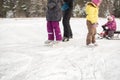 Active rest on nature. family skates on natural ice rink - lake. winter fun with children