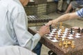 Active retired people, old friends and free time, seniors having fun and playing chess game at park. Waist up. Old men playing Royalty Free Stock Photo