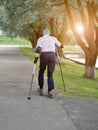 Active retiree rollerblading and making extreme turns. Autumn walks in the fresh air. Active old people