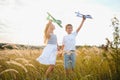 Active running kids with boy holding airplane toy. Royalty Free Stock Photo