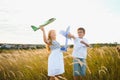 Active running kids with boy holding airplane toy. Royalty Free Stock Photo