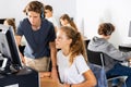 Schoolchildren preparing for lessons on the computer