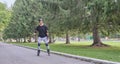 Active senior asian man is roller skating in park. Royalty Free Stock Photo