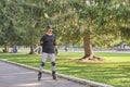 Active senior asian man is roller skating in park. Royalty Free Stock Photo