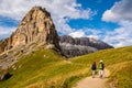 Active senior caucasian couple hiking in mountains with backpacks, enjoying their adventure. Location: Dolomites Alps, South Tyrol Royalty Free Stock Photo