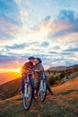 Active Senior Couple on country bike ride. Kissing on their break. Royalty Free Stock Photo