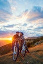 Active Senior Couple on country bike ride. Kissing on their break. Royalty Free Stock Photo