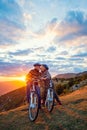 Active Senior Couple on country bike ride. Kissing on their break. Royalty Free Stock Photo