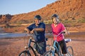 Active Senior Couple enjoying a bike ride together Royalty Free Stock Photo