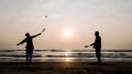 Active senior couple playing tai chi ballon ball at the beach. Royalty Free Stock Photo