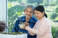active senior couple spend free time take care cactus plant together at home Royalty Free Stock Photo