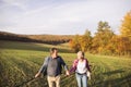 Senior couple on a walk in an autumn nature. Royalty Free Stock Photo