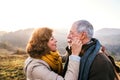 Senior couple on a walk in an autumn nature. Royalty Free Stock Photo