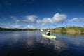 Active senior kayaking on Nine Mike Pond in Everglades National Park, Florida. Royalty Free Stock Photo